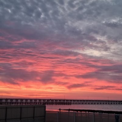 Stunning sunset over the ocean and pier.